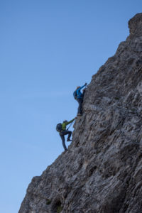 Climber on the via ferrata to Lachenspitze, Tannheimertal, Tyrol, Austria Climber on the via ferrata to Lachenspitze, Tannheimertal, Tyrol, Austria